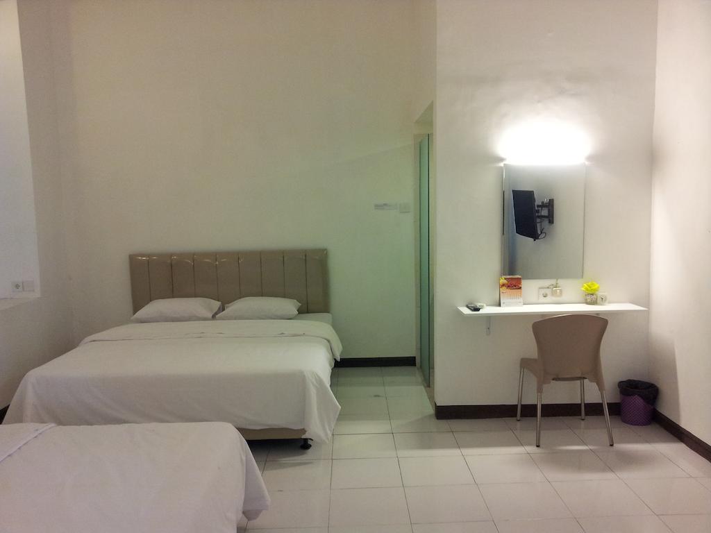 Loxy Inn Surabaya Szoba fotó